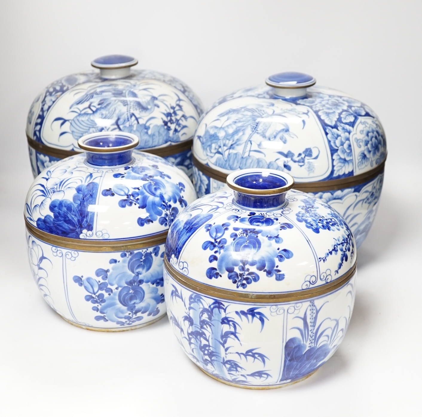 Two pairs of Japanese Arita blue and white bowls and covers, largest 27cm